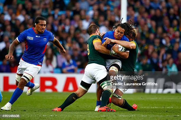 Ioane of Samoa is held up by the South Africa defence during the 2015 Rugby World Cup Pool B match between South Africa and Samoa at Villa Park on...