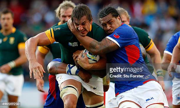 Filo Paulo of Somoa grabs hold of Eben Etzebeth of South Africa during the 2015 Rugby World Cup Pool B match between South Africa and Samoa at Villa...