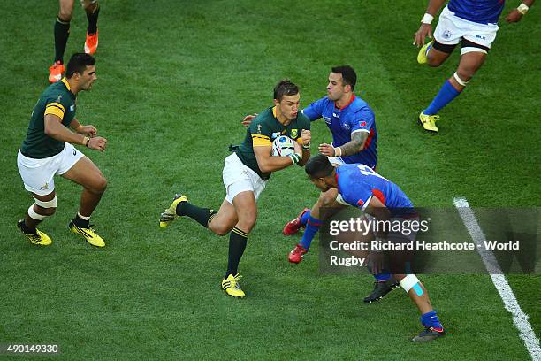 Handre Pollard of South Africa takes on the Samoa defence during the 2015 Rugby World Cup Pool B match between South Africa and Samoa at Villa Park...