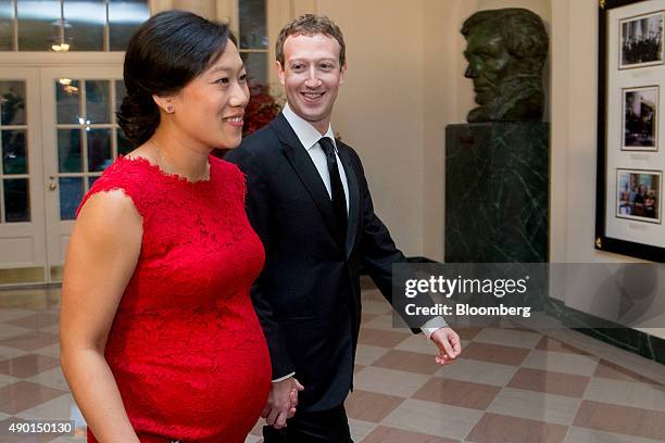 Mark Zuckerberg, chief executive officer and founder of Facebook Inc., right, and his wife Priscilla Chan arrive at a state dinner in honor of...