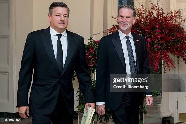Reed Hastings, president and chief executive officer of Netflix Inc., right, and Ted Sarandos, chief content officer for Netflix Inc., arrive at a...