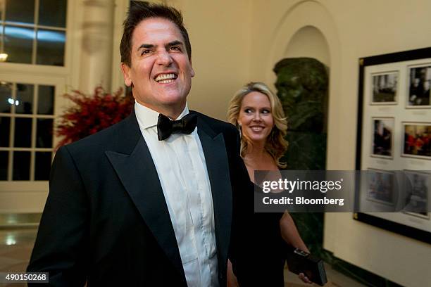 Mark Cuban, billionaire owner of the National Basketball Association's Dallas Mavericks basketball team, left, and his wife Tiffany Cuban arrive at a...