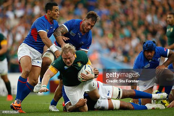 Adriaan Strauss of South Africa is tackled by Teofilo Paulo of Samoa during the 2015 Rugby World Cup Pool B match between South Africa and Samoa at...