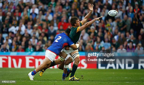 Eben Etzebeth of South Africa offloads during the 2015 Rugby World Cup Pool B match between South Africa and Samoa at Villa Park on September 26,...