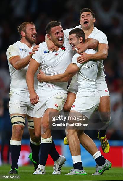 Jonny May of England celebrates with Chris Robshaw , Sam Burgess and Ben Youngs of England as he scores their first try during the 2015 Rugby World...