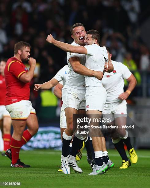 Jonny May of England is congratulated by Sam Burgess of England after scoring the first try during the 2015 Rugby World Cup Pool A match between...
