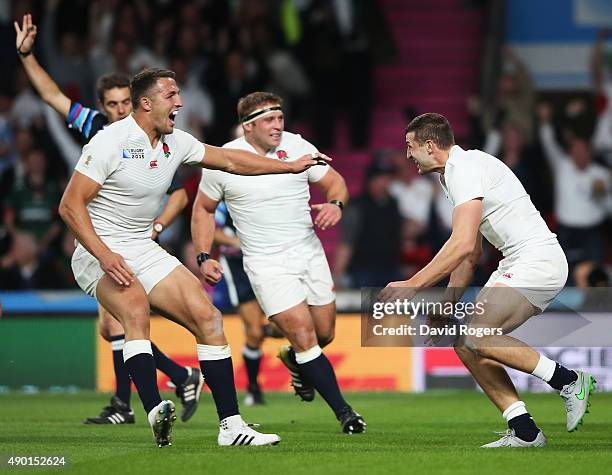 Jonny May of England celebrates scoring the first England try with Sam Burgess of England during the 2015 Rugby World Cup Pool A match between...