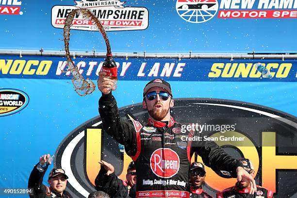 Austin Dillon, driver of the Rheem Chevrolet, celebrates in Victory Lane after winning the NASCAR Camping World Truck Series UNOH 175 at New...