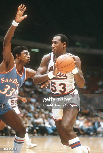 Darryl Dawkins of the New Jersey Nets drives on Jerome Whitehead of the San Diego Clippers during an NBA basketball game circa 1982 at the Brendan...