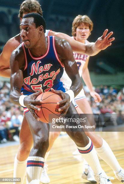 Darryl Dawkins of the New Jersey Nets in action against the Philadelphia 76ers during an NBA basketball game circa 1982 at The Spectrum in...