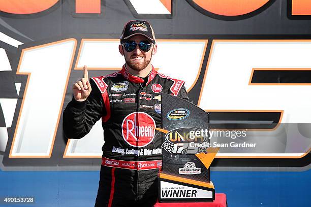 Austin Dillon, driver of the Rheem Chevrolet, celebrates in Victory Lane after winning the NASCAR Camping World Truck Series UNOH 175 at New...