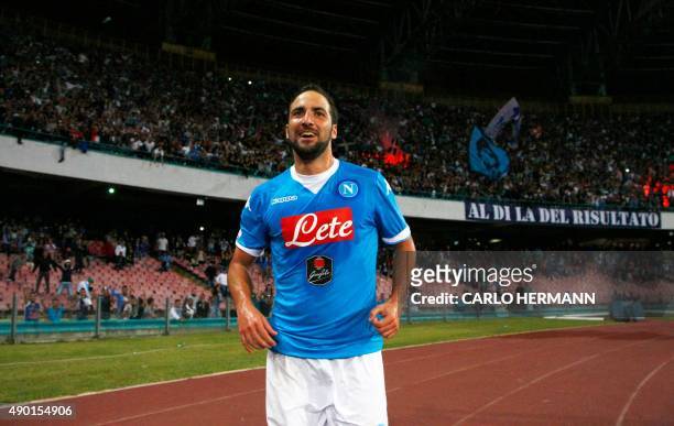 Napoli's Argentinian-French forward Gonzalo Higuain celebrates after scoring during the Italian Serie A football match SSC Napoli vs FC Juventus on...