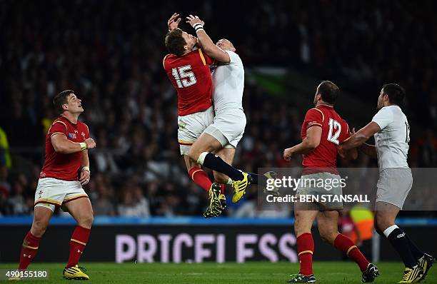 England's full-back Mike Brown and Wales' full-back Liam Williams jump for the ball during a Pool A match of the 2015 Rugby World Cup between England...