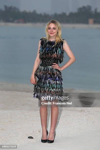 Dakota Fanning attends the Chanel Cruise Collection 2014/2015 Photocall at The Island on May 13, 2014 in Dubai, United Arab Emirates.