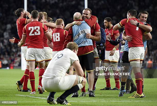 Wales' centre Jamie Roberts celebrates with teammtes after winning a Pool A match of the 2015 Rugby World Cup between England and Wales at Twickenham...