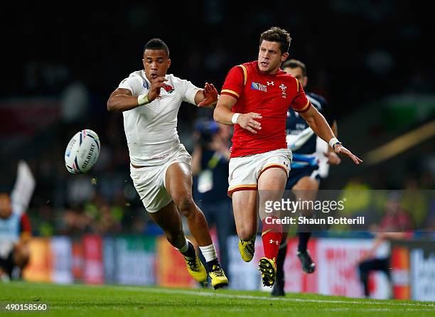Lloyd Williams of Wales and Anthony Watson of England chase the ball during the 2015 Rugby World Cup Pool A match between England and Wales at...