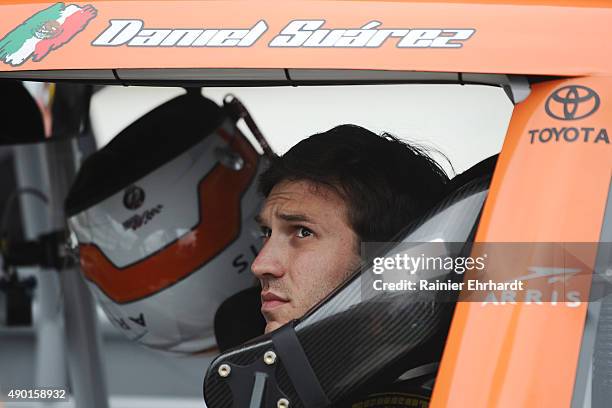 Daniel Suarez, driver of the ARRIS Toyota, sits in his car during NASCAR Xfinity Series qualifying for the Visitmyrtlebeach.com 300 at Kentucky...