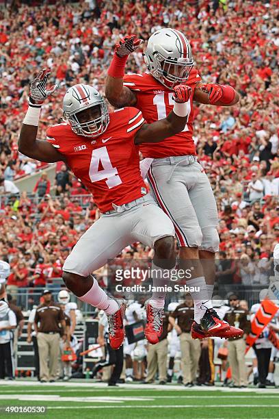 Curtis Samuel and Jalin Marshall of the Ohio State Buckeyes celebrate Marshall's second quarter touchdown against the Western Michigan Broncos at...
