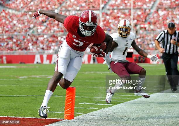 Calvin Ridley of the Alabama Crimson Tide scores a touchdown against Lenzy Pipkins of the Louisiana Monroe Warhawks at Bryant-Denny Stadium on...