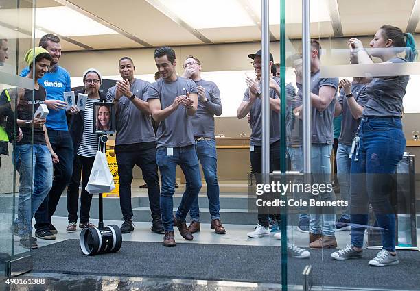 The first out of the Apple Store after cold, wet, long wait for the release of the iPhone 6s and 6s Plus at Apple Store on September 25, 2015 in...