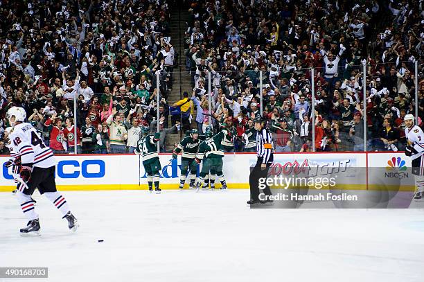 The Minnesota Wild celebrate a goal against the Chicago Blackhawks in Game Four of the Second Round of the 2014 NHL Stanley Cup Playoffs on May 9,...
