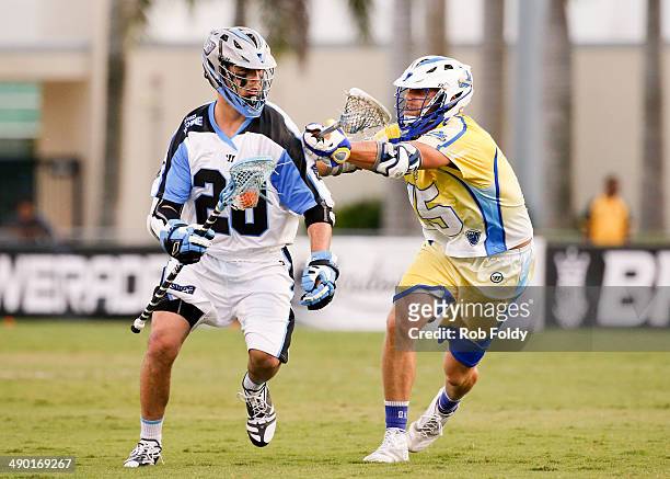 Logan Schuss of the Ohio Machine is defended by Josh Amidon of the Florida Launch during the first half of the game at Florida Atlantic University...