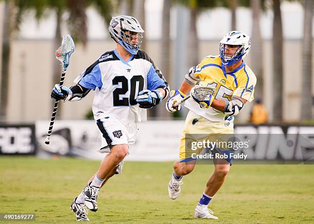 Logan Schuss of the Ohio Machine is defended by Josh Amidon of the Florida Launch during the first half of the game at Florida Atlantic University...