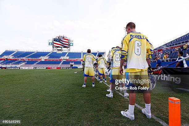 Florida Launch players line up for the singing of the National Anthem before the game against the Ohio Machine at Florida Atlantic University Stadium...