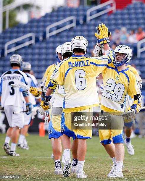 Kieran McArdle high-fives Kevin Cunningham of the Florida Launch during the first half of the game against the Ohio Machine at Florida Atlantic...