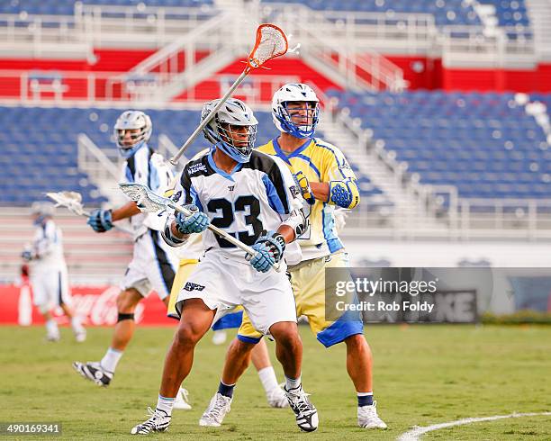 Dominique Alexander of the Ohio Machine is defended by Casey Powell of the Florida Launch during the first half of the game at Florida Atlantic...