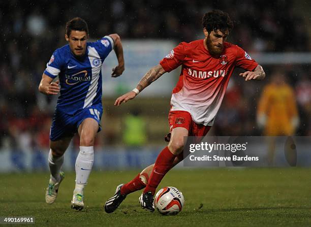 Romain Vincelot of Leyton Orient breaks away from Tommy Rowe of Peterborough United during the Sky Bet League One play-off semi-final second leg...