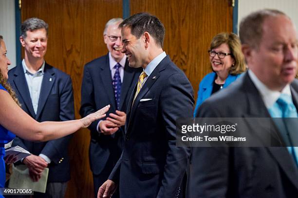 Sen. Marco Rubio, R-Fla., shares a laugh with Donna Leinward, left, of USA Today, before the National Press Club Newsmaker Luncheon at the club. Also...