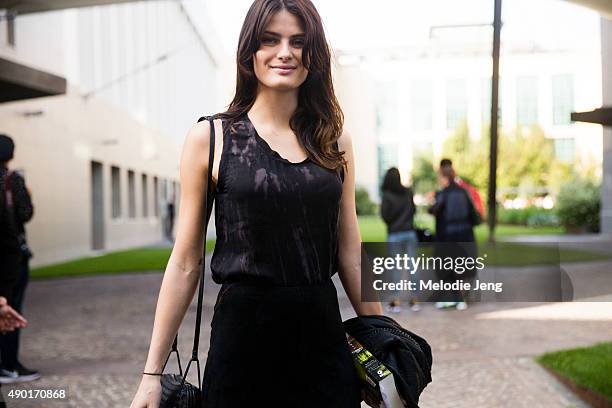 Top Brazilian model Isabeli Fontana exits the Bottega Veneta show in an all black outfit during the Milan Fashion Week Spring/Summer 16 on September...