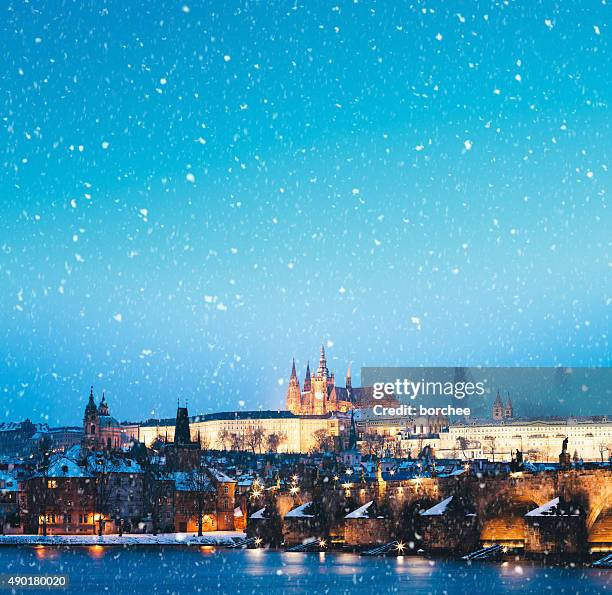 snowing in prague - vltava river stockfoto's en -beelden