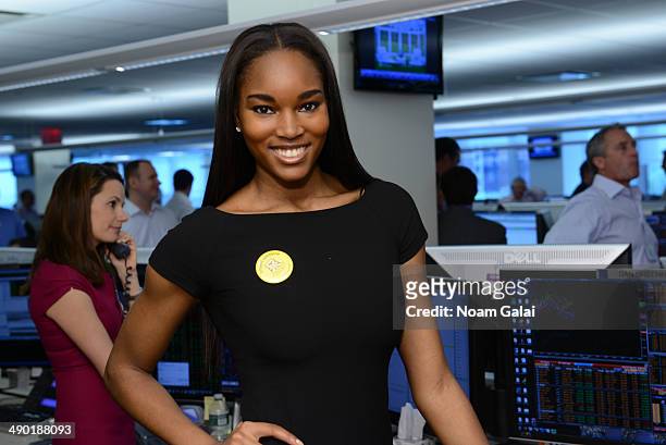 Project Sunshine supporter Damaris Lewis participates in BTIG's 12th annual Commissions for Charity Day at BTIG's trading floor on May 13, 2014 in...