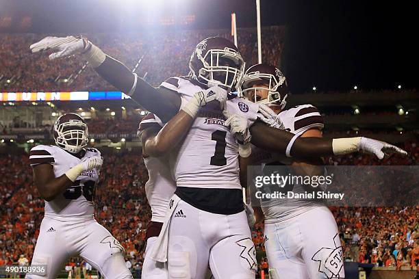 De'Runnya Wilson of the Mississippi State Bulldogs celebrates a touchdown catch during the first half against the Auburn Tigers at Jordan Hare...