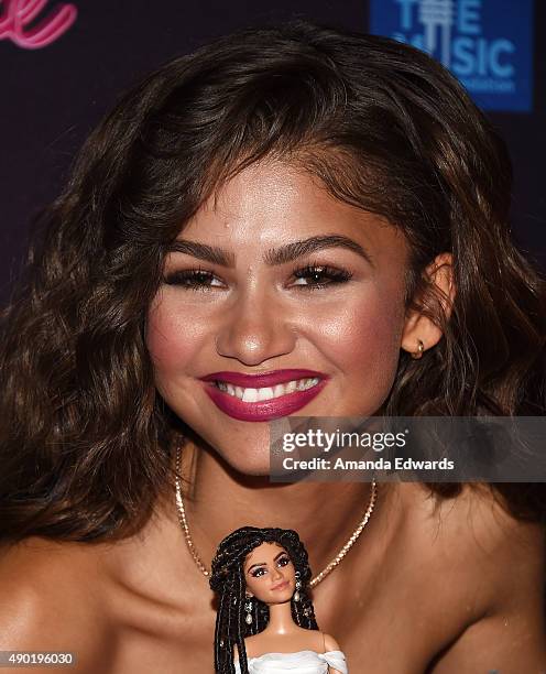 Actress and singer Zendaya poses with a Zendaya Barbie doll at the Barbie Rock 'N Royals Concert Experience at the Hollywood Palladium on September...