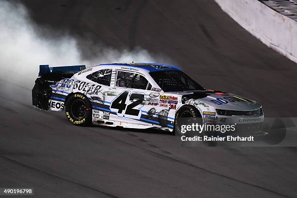 Brennan Poole, driver of the DC Solar Chevrolet, crashes during the NASCAR Xfinity Series Visitmyrtlebeach.com 300 at Kentucky Speedway on September...