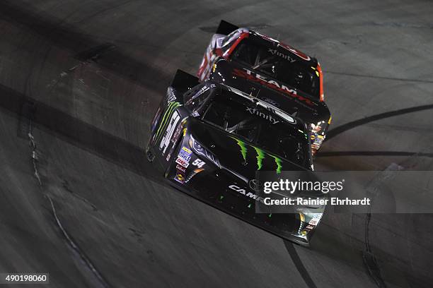 Erik Jones, driver of the Monster Energy Toyota, leads Darrell Wallace Jr., driver of the Bleacher Report Ford, during the NASCAR Xfinity Series...