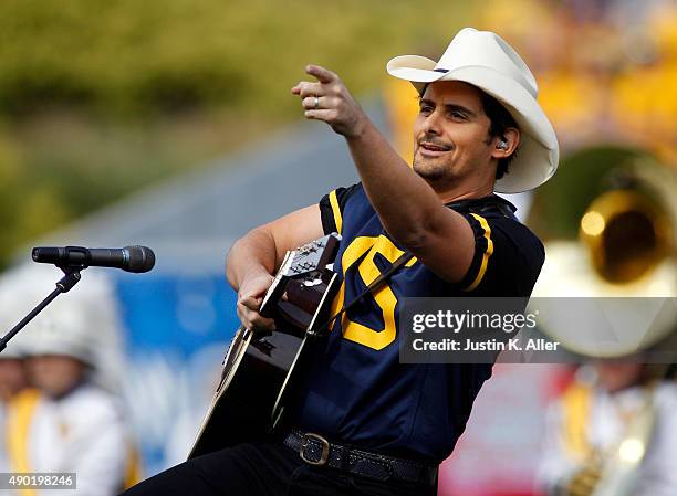 Brad Paisley performs before the game between the West Virginia Mountaineers and the Maryland Terrapins on September 26, 2015 at Mountaineer Field in...