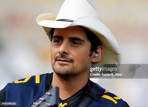 Brad Paisley performs before the game between the West Virginia Mountaineers and the Maryland Terrapins on September 26, 2015 at Mountaineer Field in...