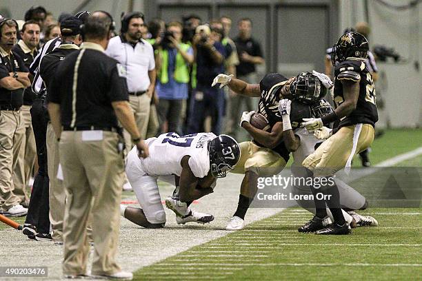 Running back Elijhaa Penny of the Idaho Vandals gets his helmet ripped off during second half action against the Georgia Southern Eagles on September...