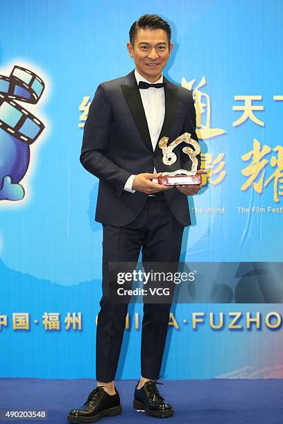 Actor and singer Andy Lau wins the Best Actor during the 2nd Silk Road International Film Festival at Haixia Olympic Center Stadium on September 26,...