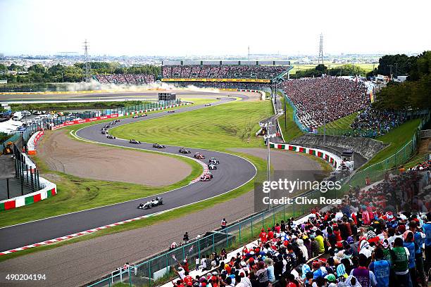 Lewis Hamilton of Great Britain and Mercedes GP drives ahead of Sebastian Vettel of Germany and Ferrari, Valtteri Bottas of Finland and Williams and...