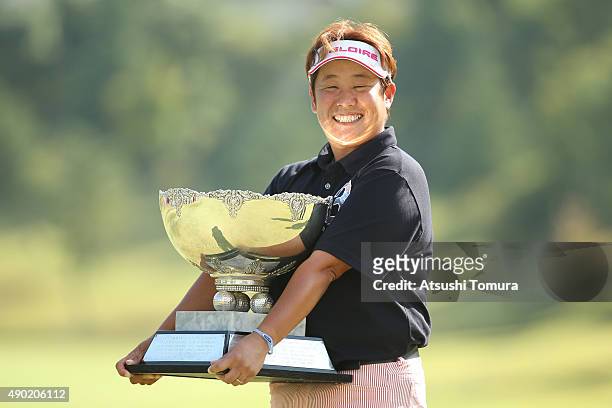 Junko Omote of Japan poses with trophy after winning the Miyagi TV Cup Dunlop Ladies Open 2015 at the Rifu Golf Club on September 27, 2015 in Rifu,...