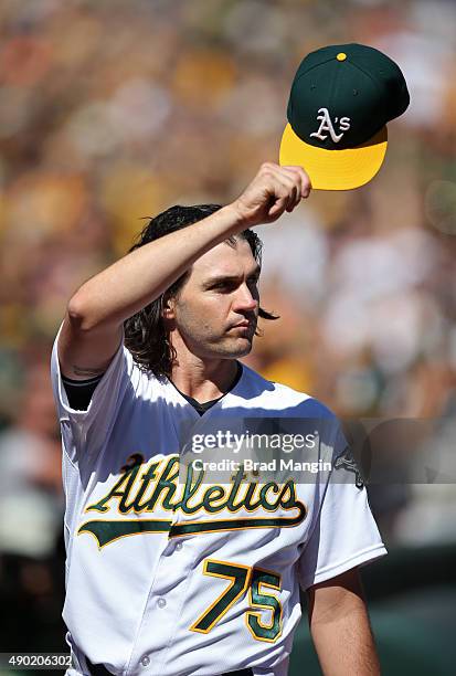 Barry Zito of the Oakland Athletics tips his cap and waves to the crowd after being removed from the game against the San Francisco Giants during the...