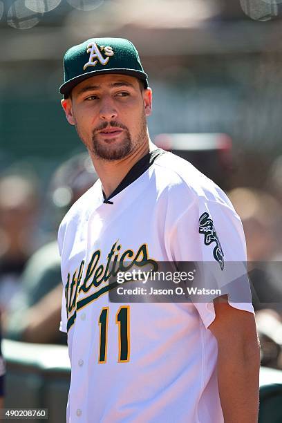 Basketball player Klay Thompson of the Golden State Warriors stands on the field before the game between the Oakland Athletics and the San Francisco...