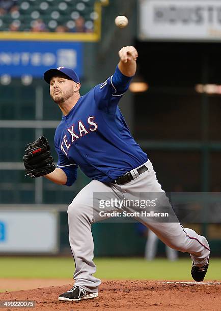 Matt Harrison of the Texas Rangers throws a pitch in the first inning of their game against the Houston Astros at Minute Maid Park on May 13, 2014 in...