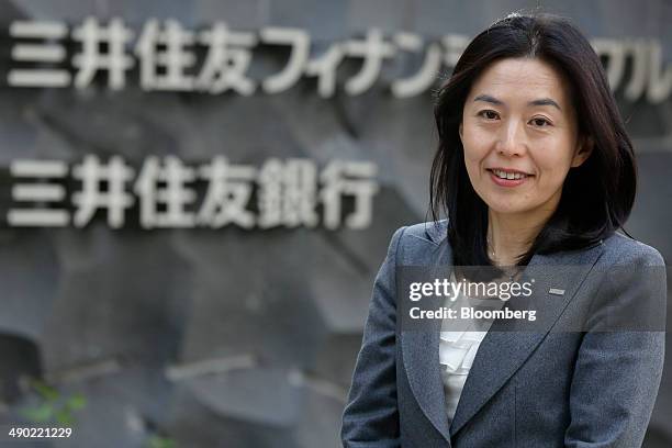 Teiko Kudo, director at Sumitomo Mitsui Banking Corp., poses for a photograph outside the company's headquarters in Tokyo, Japan, on Friday, April...