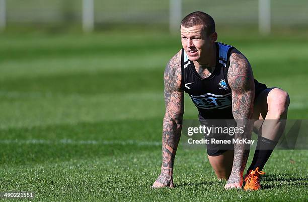 Todd Carney stretches during a Cronulla Sharks NRL training session at Remondis Stadium on May 14, 2014 in Sydney, Australia.